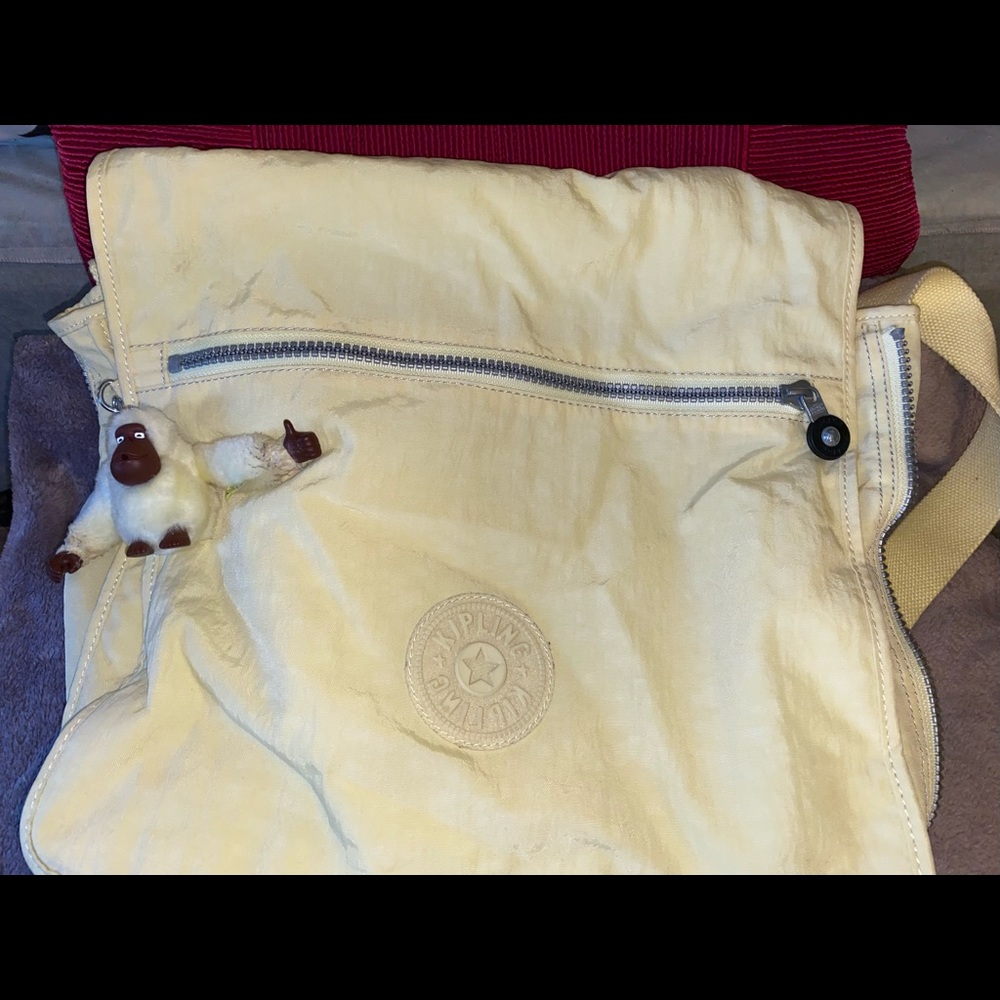 Pale yellow Kipling Messenger bag